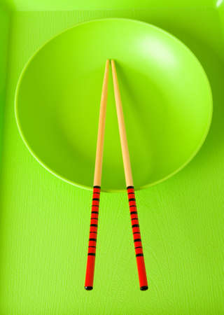 Asian food concept with plate and chopsticksの写真素材