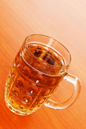 Beer glass on the wooden tableの写真素材