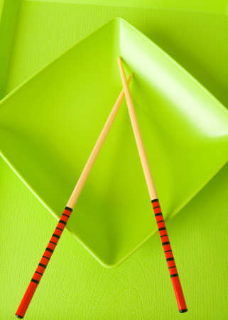 Asian food concept with plate and chopsticksの写真素材