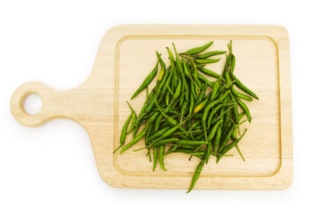 Pepper and cutting board isolated on the whiteの写真素材