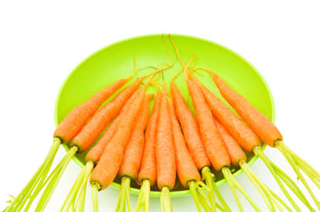 Fresh carrots isolated on the whiteの写真素材