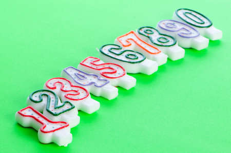 Birthday candles against colourful background