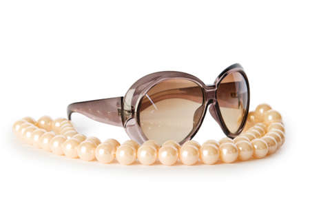 Pearl necklace and sunglasses isolated on the white backgroundの写真素材