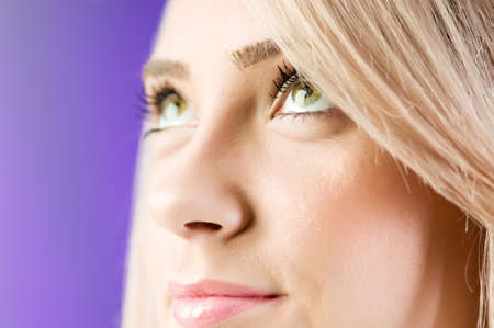 Blond girl against colourful backgroundの写真素材