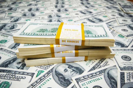 Stack of dollars on money backgroundの写真素材