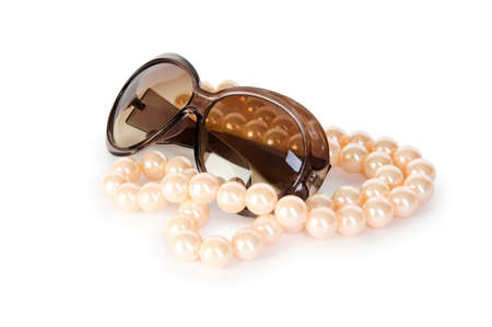 Pearl necklace and sunglasses isolated on the white backgroundの写真素材