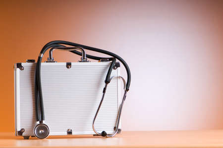 Doctor's case with stethoscope against colorful backgroundの写真素材