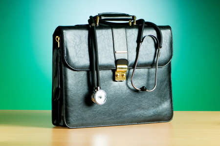 Doctor's case with stethoscope against colorful backgroundの写真素材