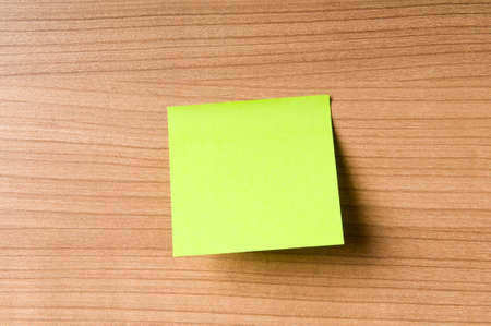 Many reminder notes on the wooden background