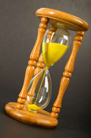 Time concept - hourglass against the gradient background