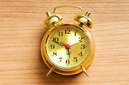 Time concept - alarm clock against the backgroundの写真素材