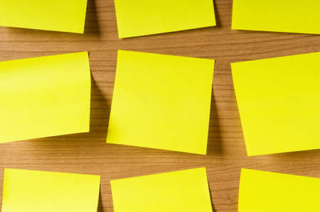 Many reminder notes on the wooden background