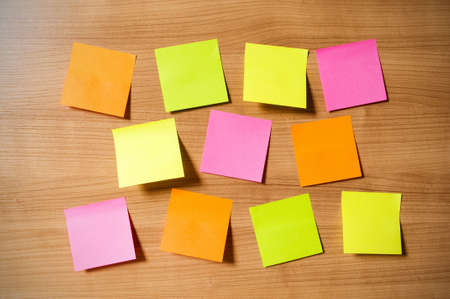 Many reminder notes on the wooden background