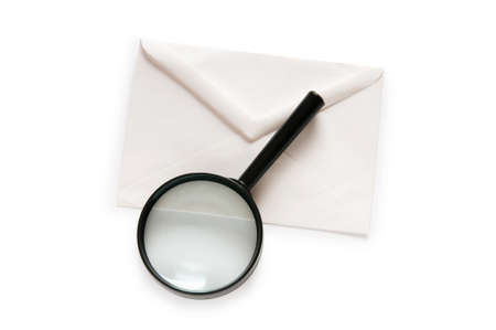 Envlope and magnifying glass isolated on white