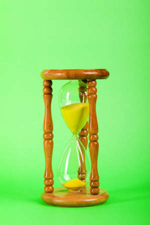Time concept - hourglass against the gradient backgroundの写真素材