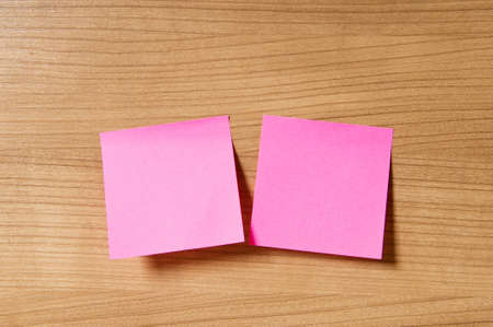 Many reminder notes on the wooden backgroundの写真素材