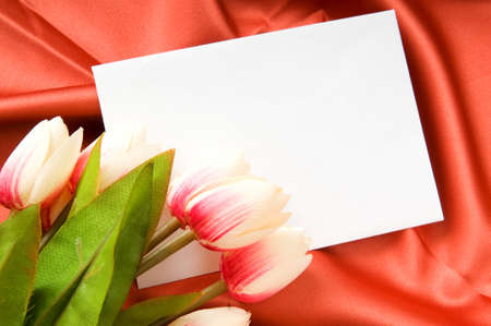 Envelope and flowers on the satin backgroundの写真素材