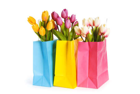 Tulips in shopping bag isolated on whiteの写真素材