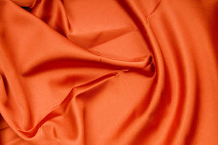 Bright satin fabric folded to be used as backgroundの写真素材