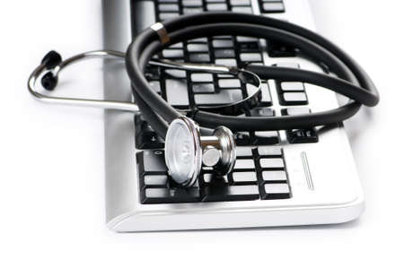 Stethoscope and keyboard illustrating concept of digital security の写真素材