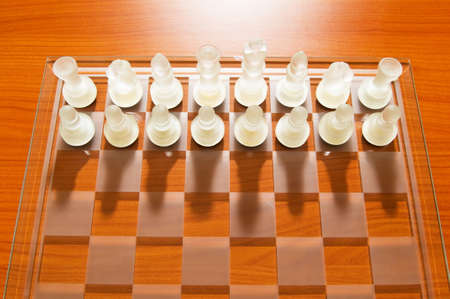 Set of chess figures on the playing boardの写真素材