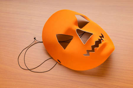 Orange scary halloween mask as holiday conceptの写真素材