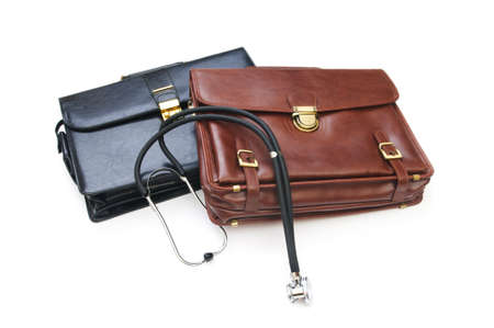 Cases and stethoscope isolated on the whiteの写真素材
