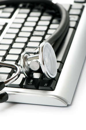 Stethoscope and keyboard illustrating concept of digital security の写真素材