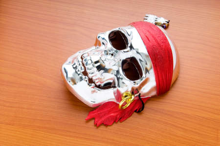 Skull mask isolated on the wooden backgroundの写真素材