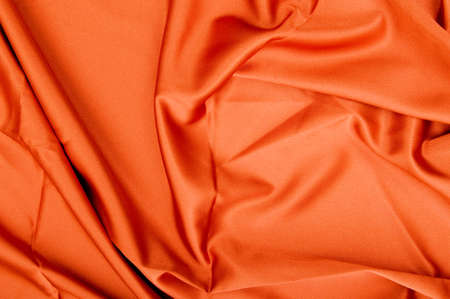 Bright satin fabric folded to be used as backgroundの写真素材