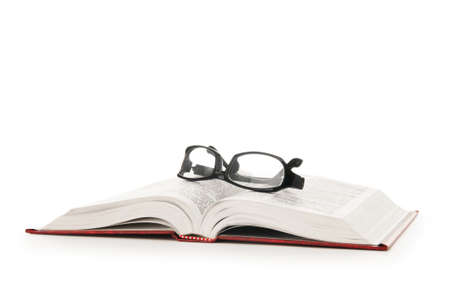 Reading glasses with books isolated on the white