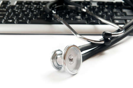 Stethoscope and keyboard illustrating concept of digital security の写真素材