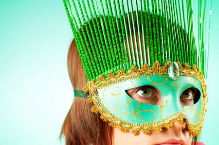 Attractive woman posing in the stylish maskの写真素材