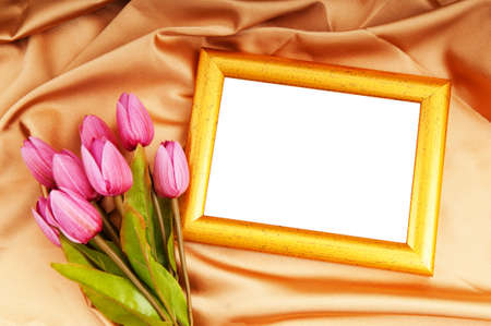 Picture frames and tulips flowers on satinの写真素材
