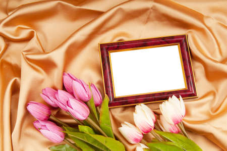 Picture frames and tulips flowers on satinの写真素材