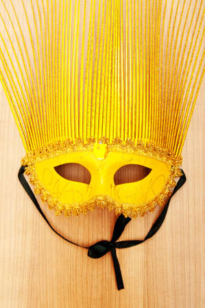 Ornate masks isolated on the wooden backgroundの写真素材