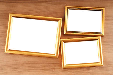 Picture frames on the polished wooden backgroundの写真素材