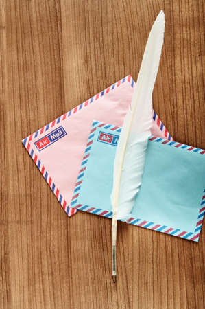 Writing feather and envelopeの写真素材