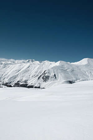 High mountains under snow in the winterの写真素材
