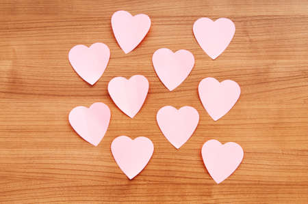 Heart shaped sticky notes on the backgroundの写真素材