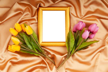 Picture frames and tulips flowers on satinの写真素材