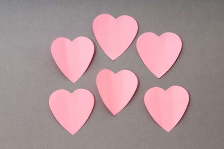 Heart shaped sticky notes on the backgroundの写真素材