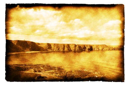 Coastline of Scotland  - vintage photo on burnt paperの写真素材