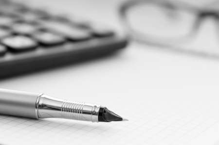 Business concept with notepad and calculatorの写真素材