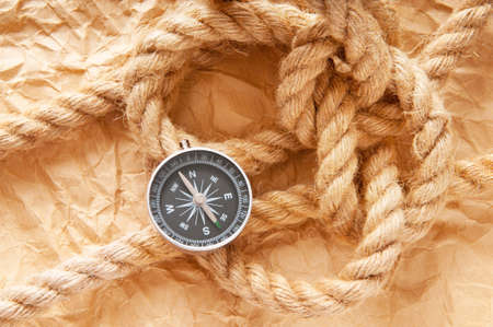 Compass and rope in travel and adventure conceptの写真素材
