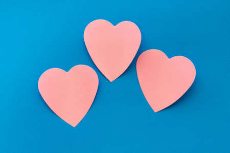 Heart shaped sticky notes on the backgroundの写真素材