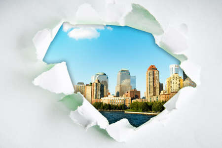 New York city through hole in paperの写真素材