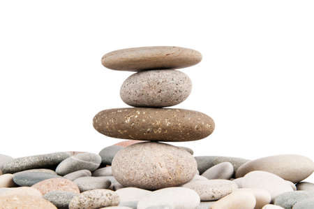 Stack of pebbles isolated on the white の写真素材