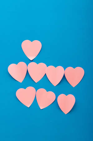 Heart shaped sticky notes on the background