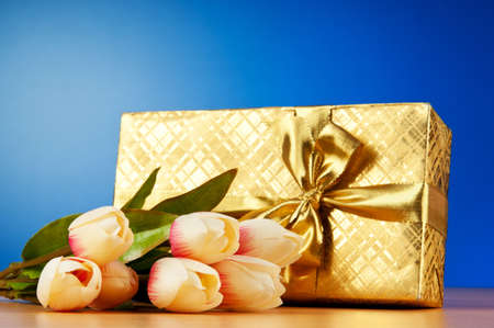 Celebration concept - gift box and tulip flowers の写真素材
